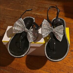 Sparkly Black and Silver Kids Sandals is plastic